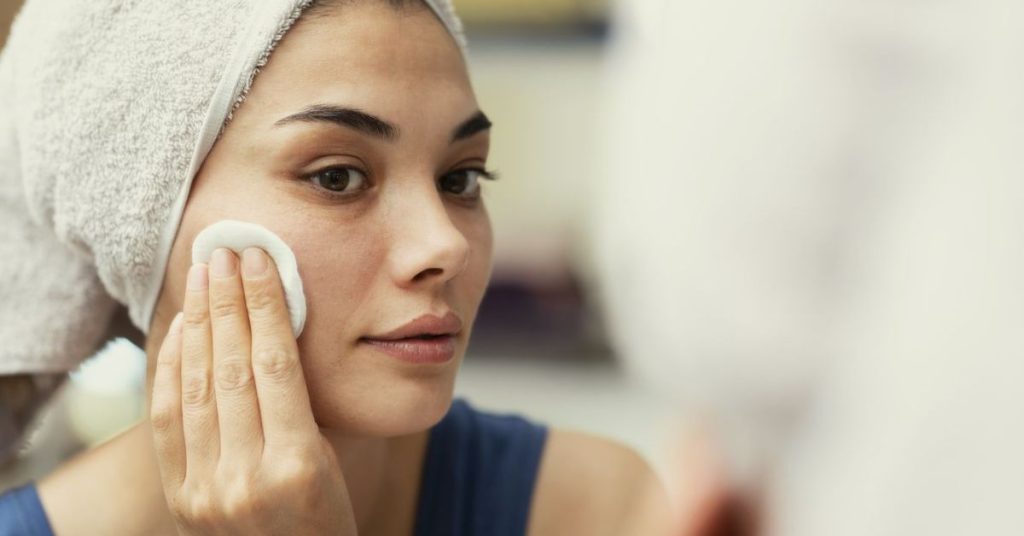 Girl applying face care