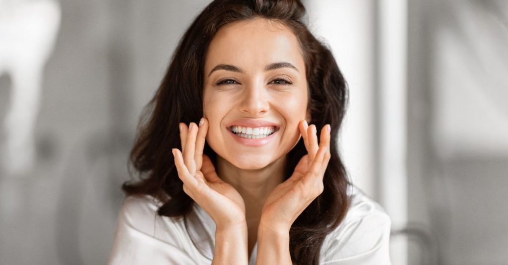 Model with smile against skin whitening cream safety